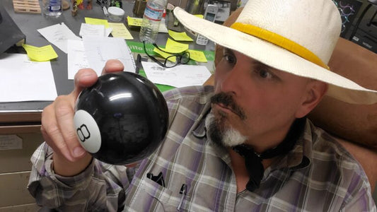 An image of Farmer Tony consulting his 'Magic 8 Ball' for farming advice